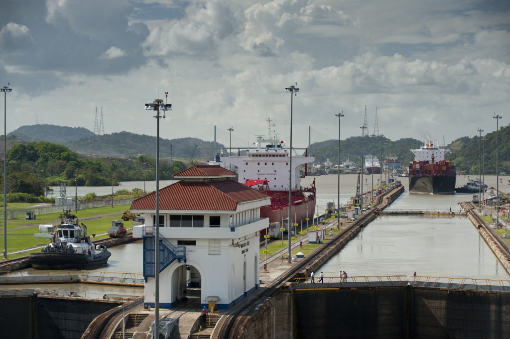 Cargo ships arriving to Miraflores Locks. Panama Canal, Panama City, Panama, Central America.