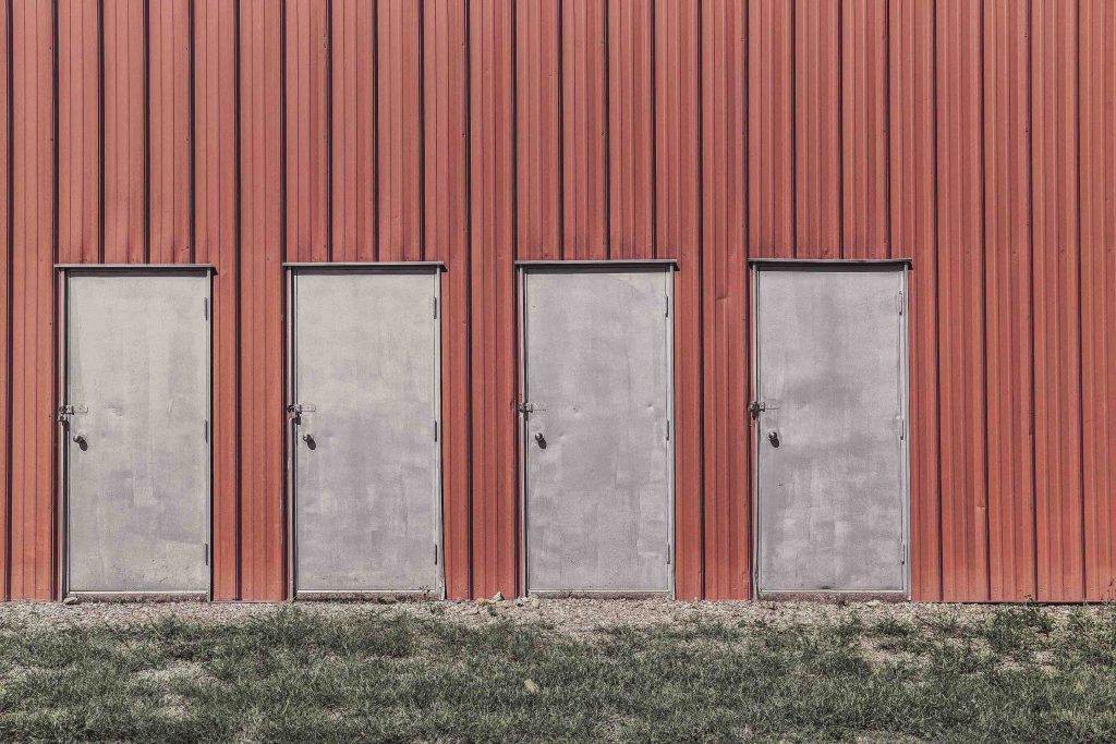 Four doors of a warehouse next to each other