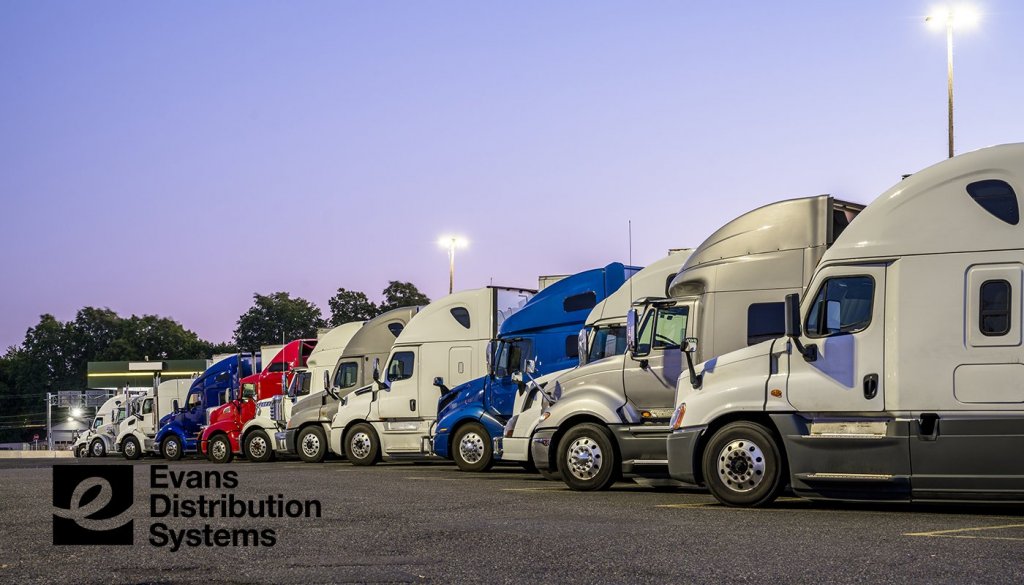 ATA Trucking Tonnage Index image. A line of trucks parked in a row.